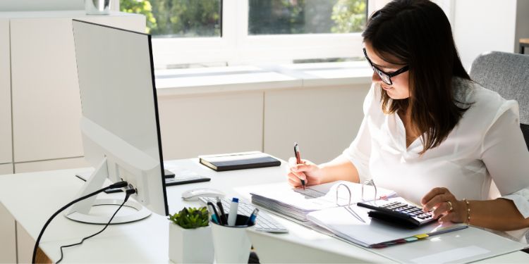 woman at a desk with a job as a bookkeper