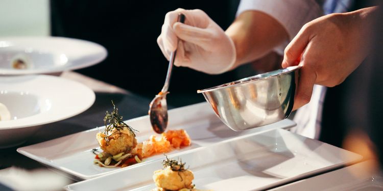 chef arranging food on plates