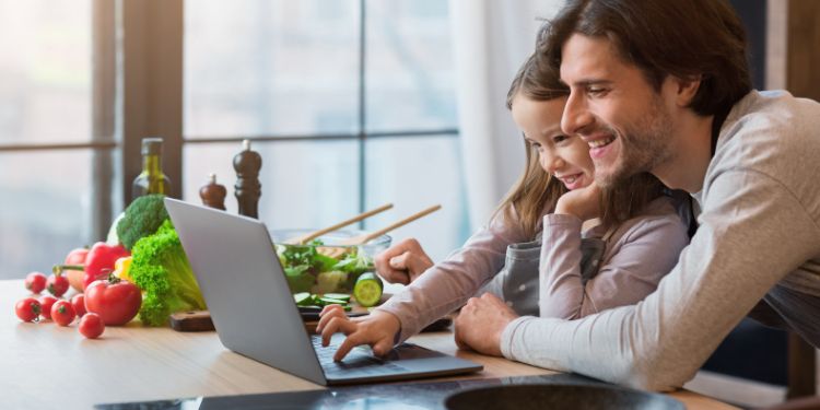 dad and kid on a computer