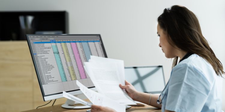 woman at a computer doing a medical coder job