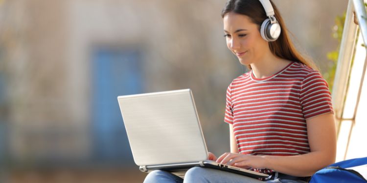 teen typing on a computer for a transcription job